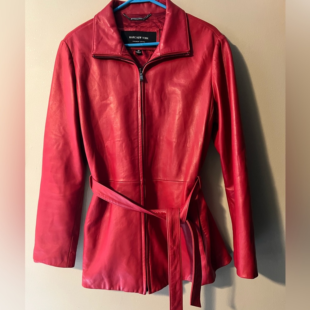 Marc New York zip up red belted
Leather lined jacket in like new condition sz M.